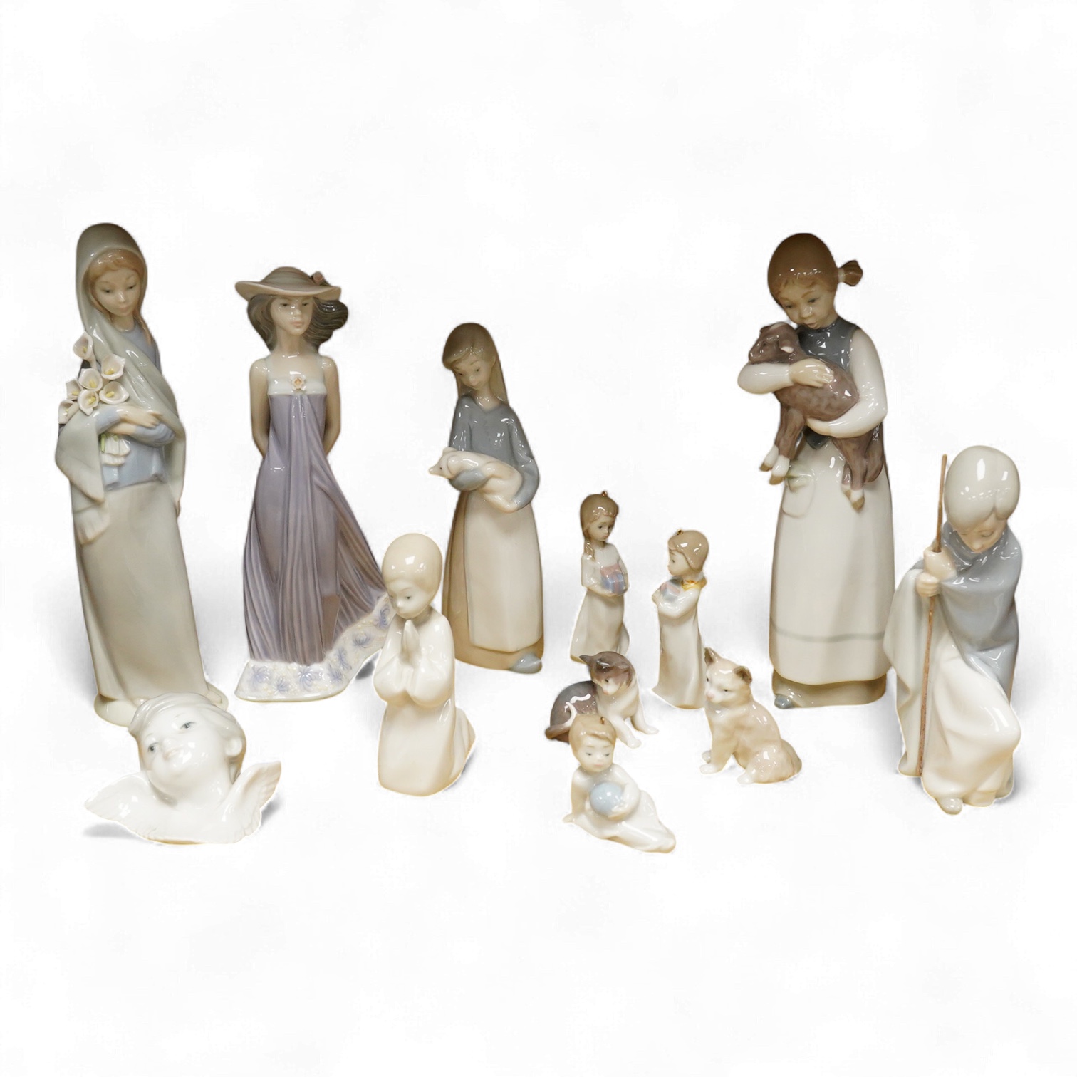 A group of twelve Lladro figures/animals, tallest 23cm